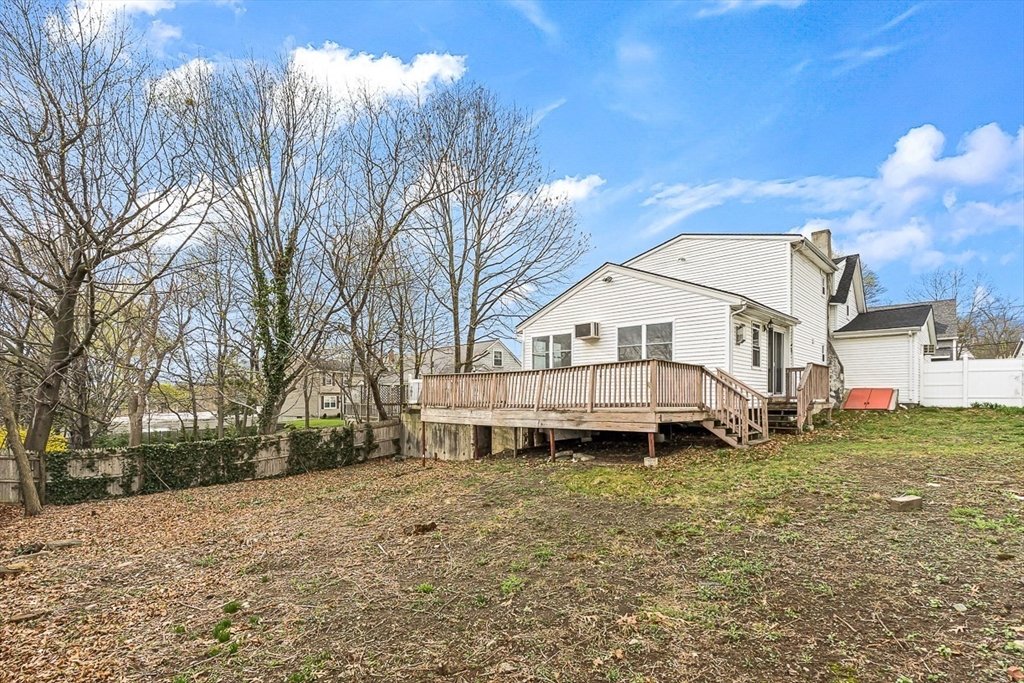 15 Tremont Street Stoneham, MA 02180 - Photo 36 of 38 a view of a house with a yard and sitting area