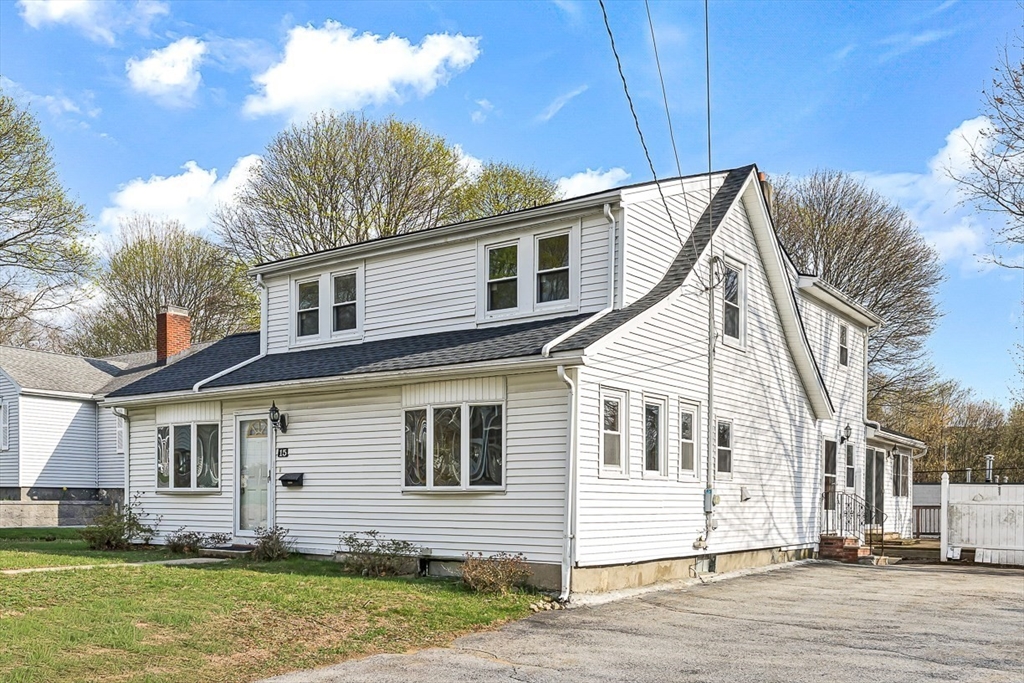 15 Tremont Street Stoneham, MA 02180 - Photo 4 of 38 a front view of a house with a yard
