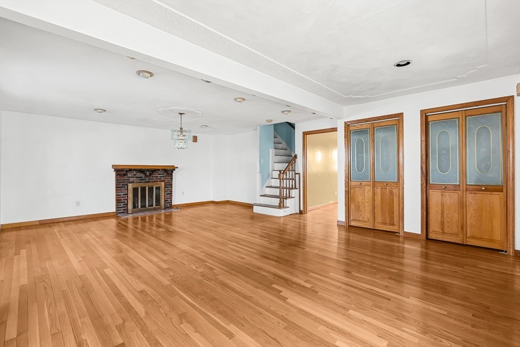 15 Tremont Street Stoneham, MA 02180 - Photo 7 of 38 a view of empty room with wooden floor