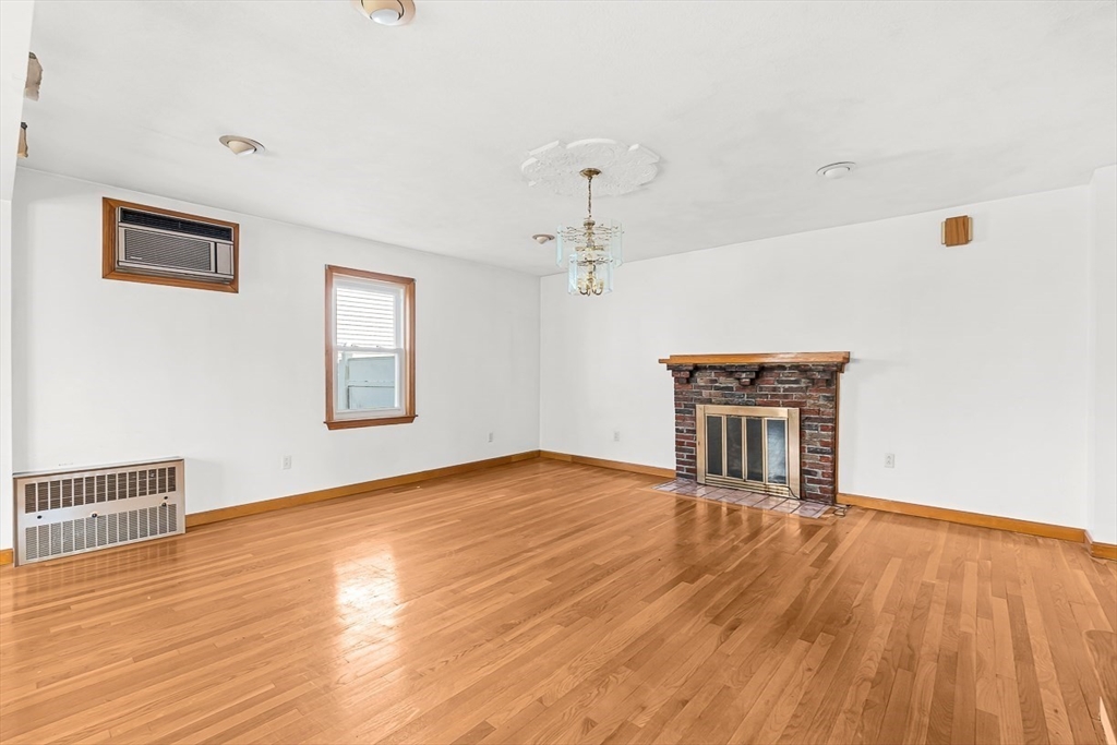 15 Tremont Street Stoneham, MA 02180 - Photo 10 of 38 a view of a livingroom with a workspace