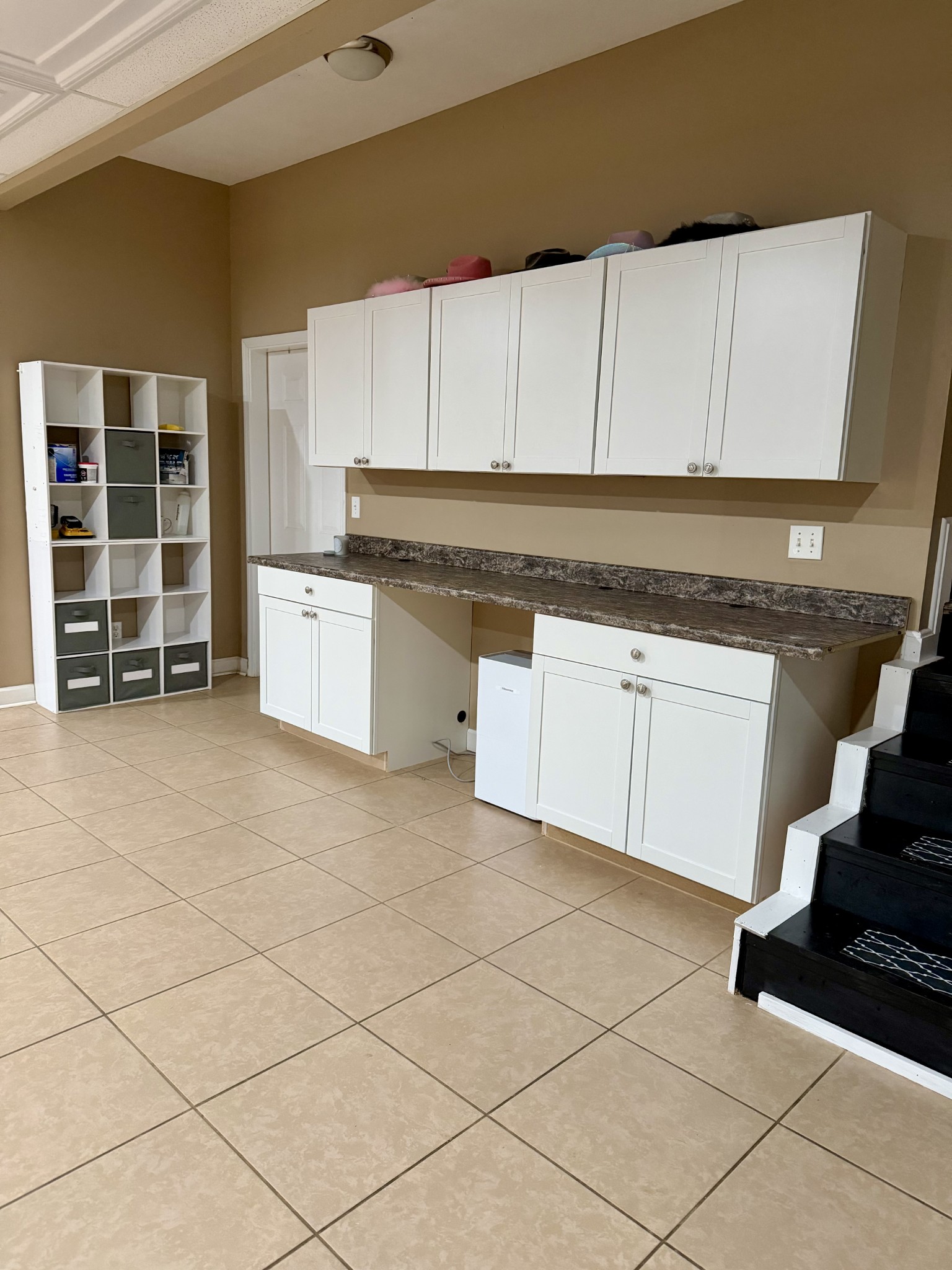 1198 Ed Sanders Road Lynchburg, TN 37352 - Photo 22 of 32 a kitchen with granite countertop a stove a sink and a white cabinets