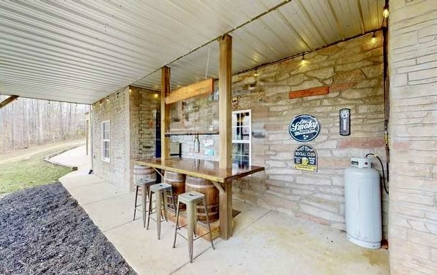 1198 Ed Sanders Road Lynchburg, TN 37352 - Photo 25 of 32 a view of a patio with table and chairs and potted plants