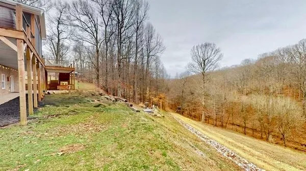 a view of a backyard of the house