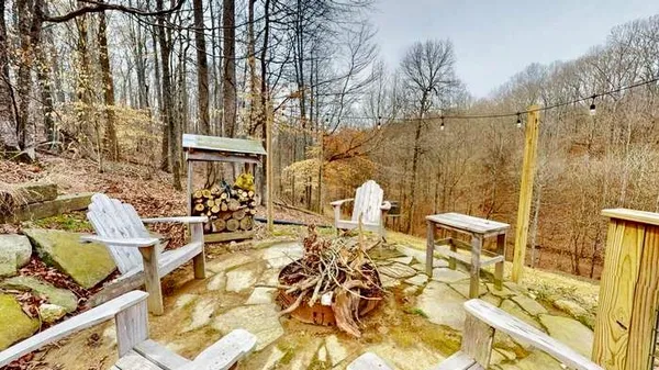 a view of a patio with table and chairs and wooden floor