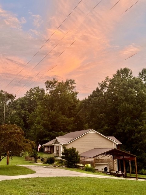 1198 Ed Sanders Road Lynchburg, TN 37352 - Photo 3 of 32 a view of a white house with a big yard and large trees
