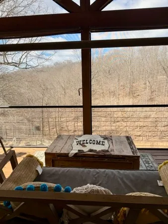 a table with a view of living room and window