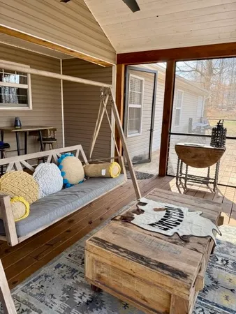 a living room filled with furniture and a table