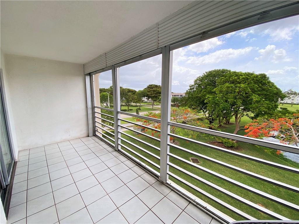 4055 Newcastle A, Unit 4055 Boca Raton, FL 33434 - Photo 13 of 23 a view of a room with a large window
