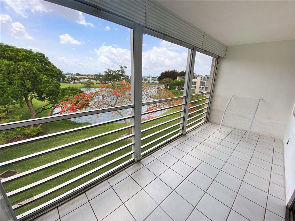 4055 Newcastle A, Unit 4055 Boca Raton, FL 33434 - Photo 15 of 23 a view of a balcony with city view