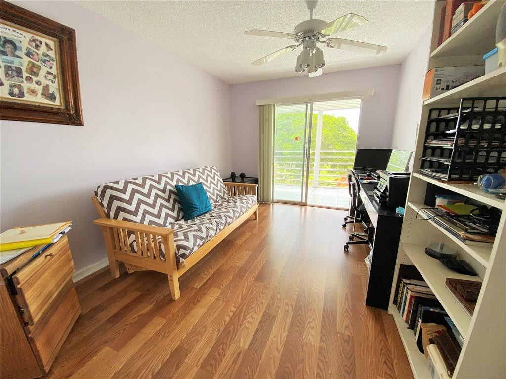 4055 Newcastle A, Unit 4055 Boca Raton, FL 33434 - Photo 10 of 23 a living room with furniture and a wooden floor