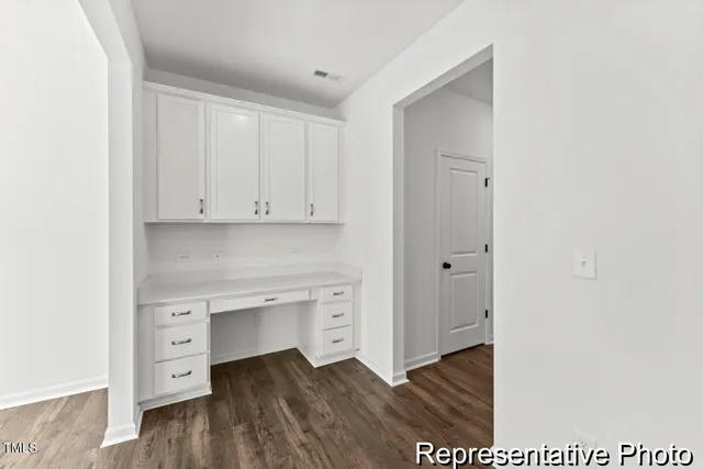 a view of cabinets and wooden floor