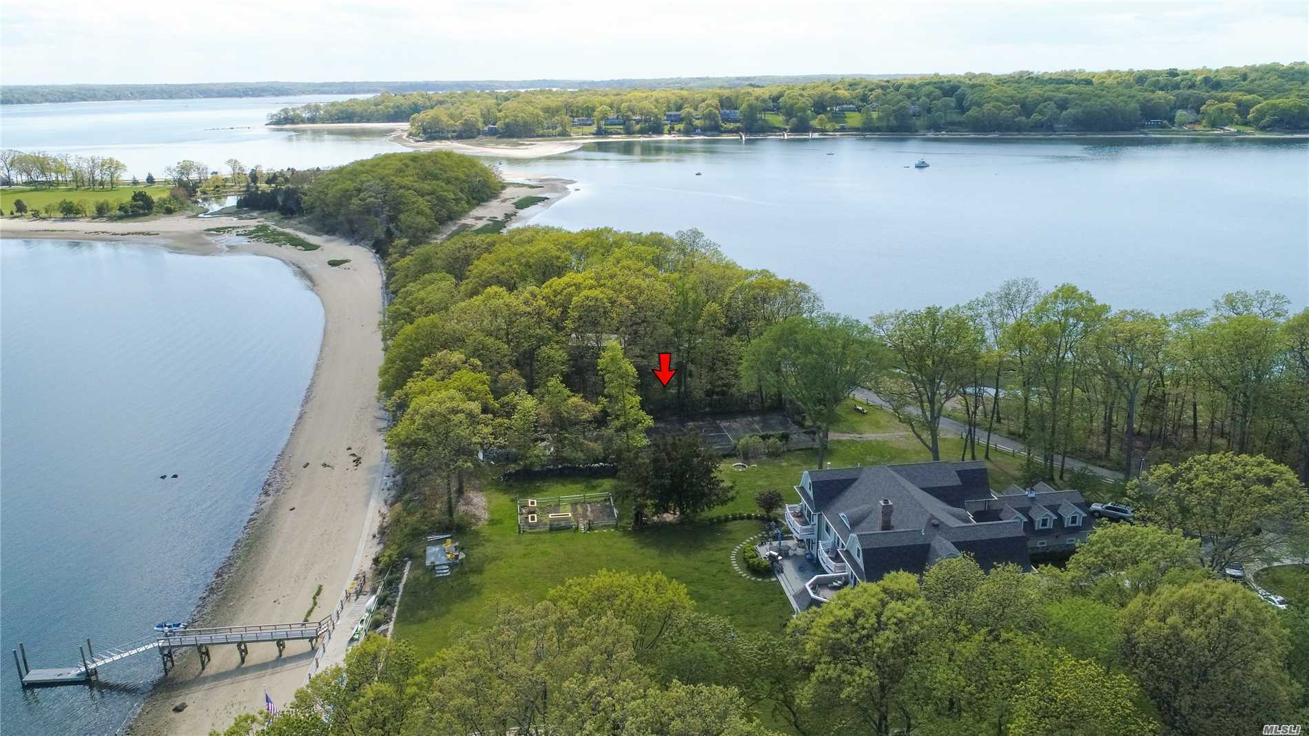 aerial view of a house with a lake view