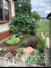 15 Burns Road North Brunswick, NJ 08902 - Photo 6 of 26 a view of a garden with a lake