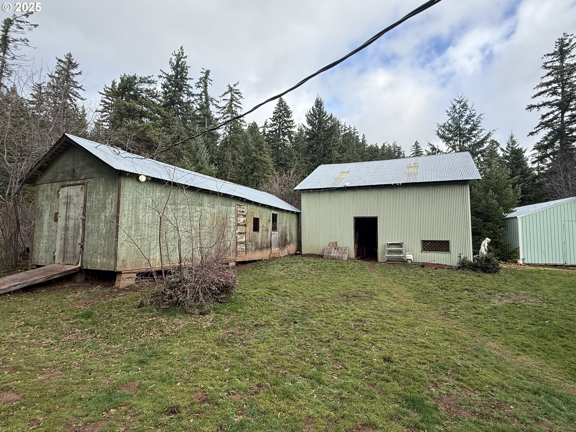 627 Canyon Road Lyle, WA 98635 - Photo 2 of 22 a house with trees in the background