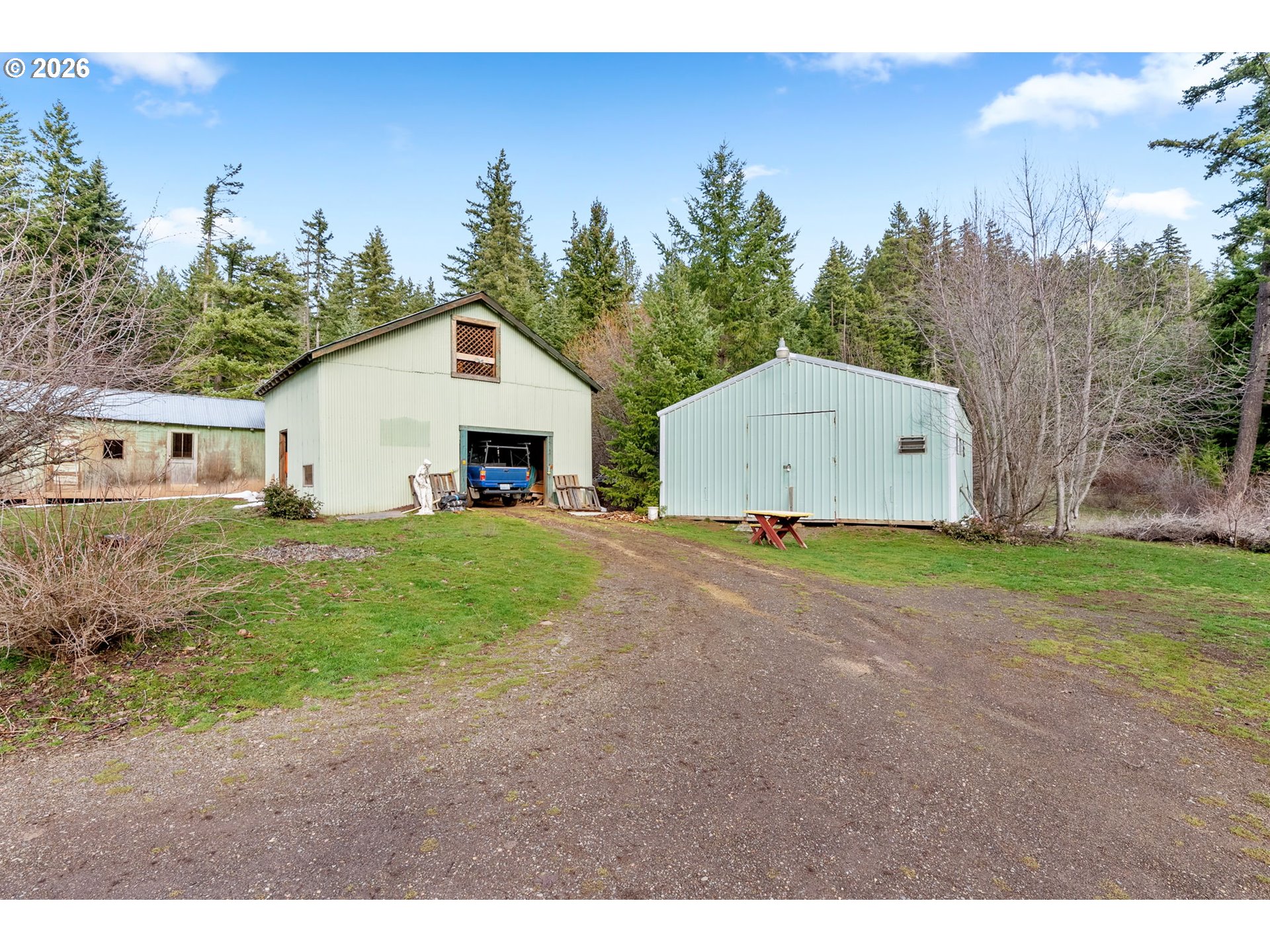 627 Canyon Road Lyle, WA 98635 - Photo 22 of 22 a front view of a house with a yard and garage