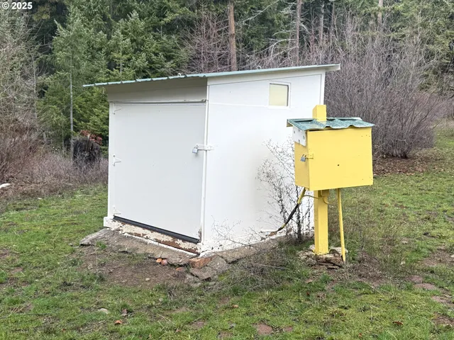 a house with trees in the background
