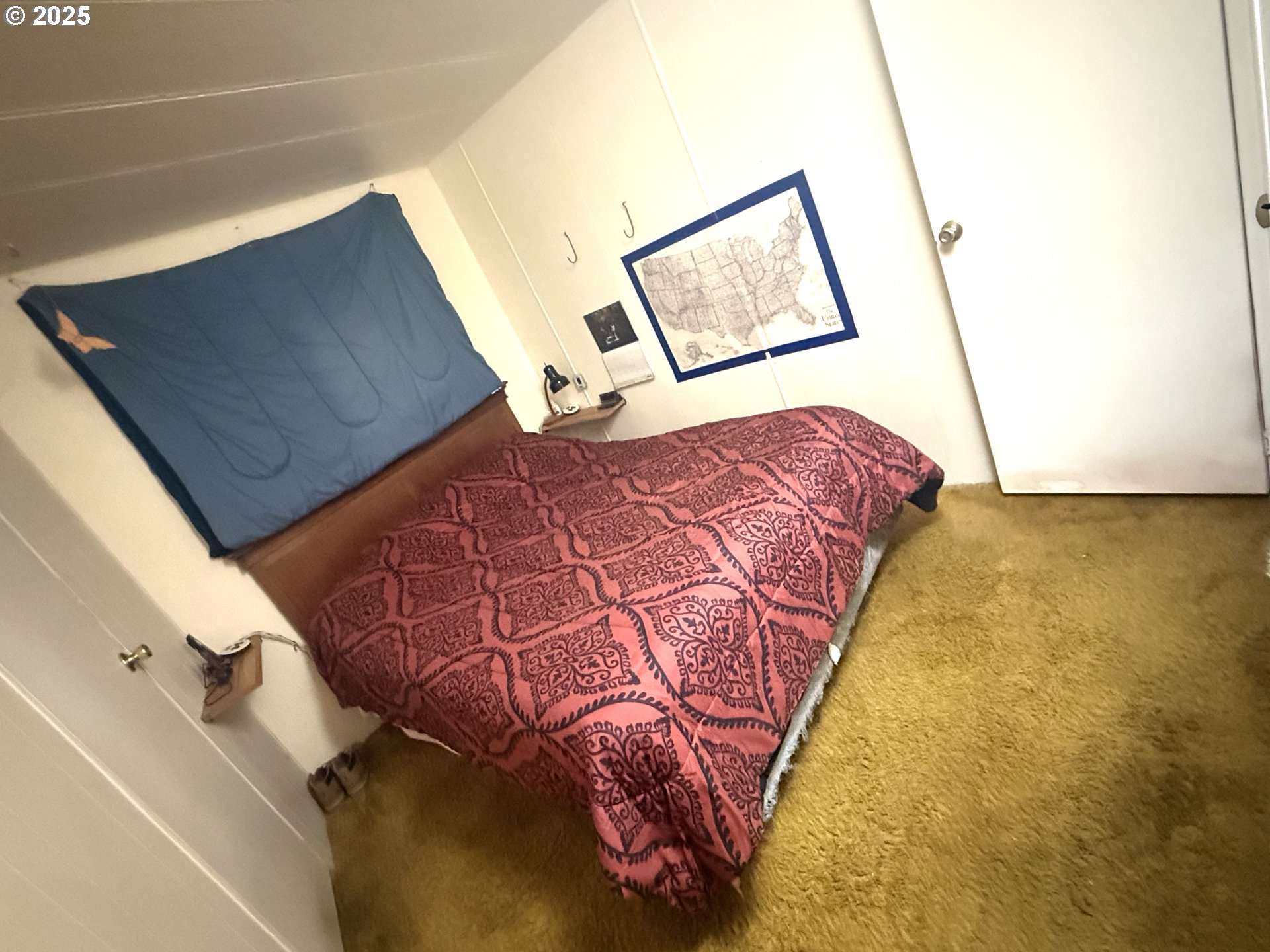 627 Canyon Road Lyle, WA 98635 - Photo 10 of 22 a bedroom with a bed and a mirror