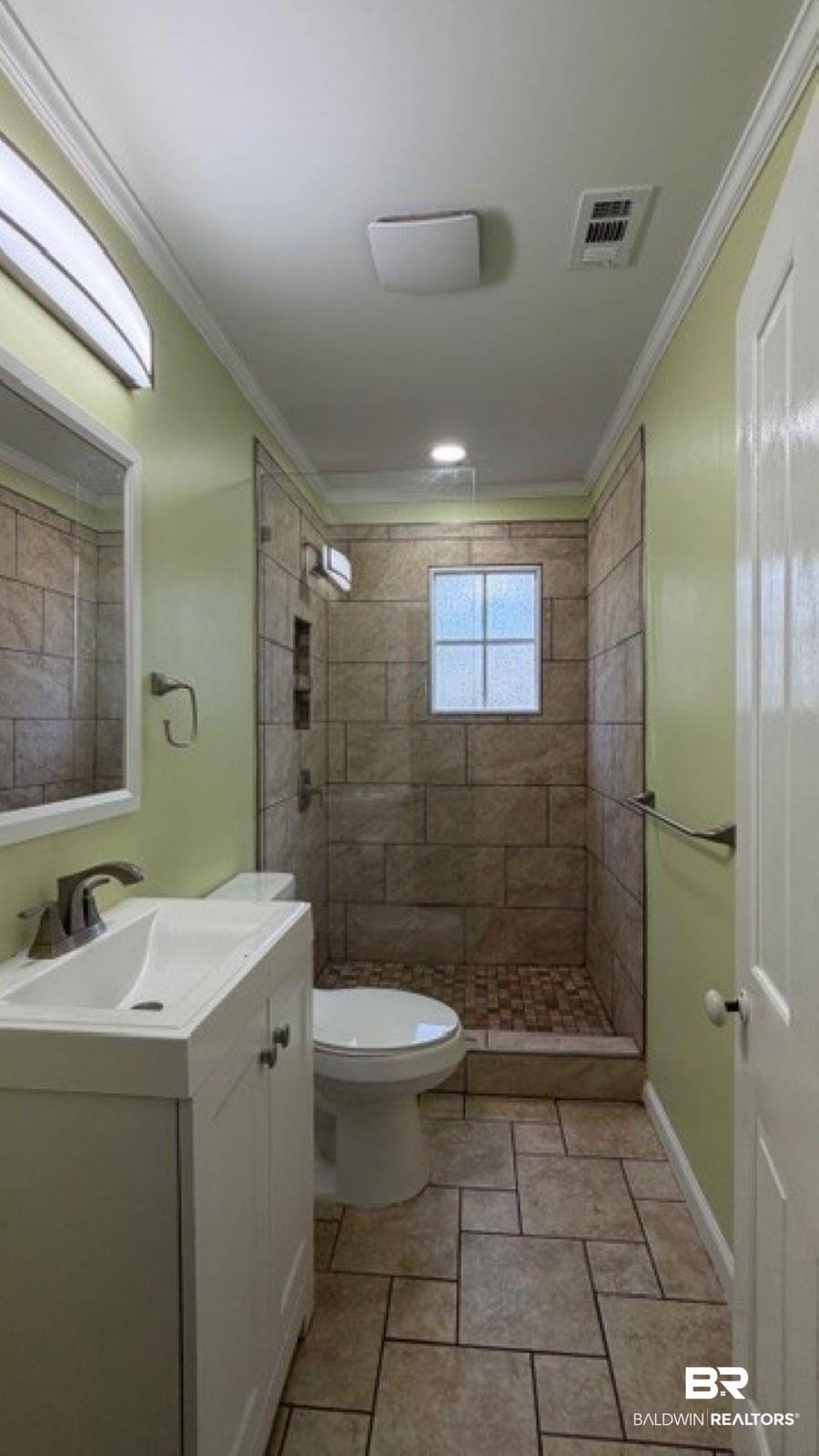 3006 Pleasant Valley Road Mobile, AL 36606 - Photo 18 of 20 Full bathroom featuring vanity, a stall shower, light stone finish floors, and crown molding