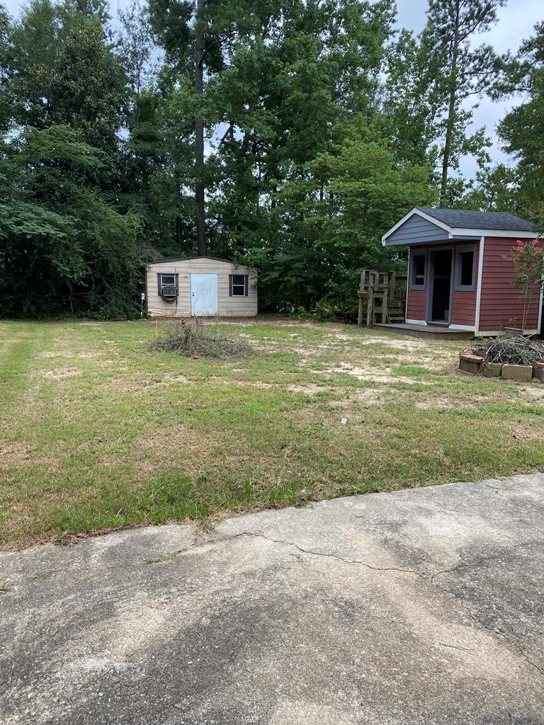 1609 4th Place Phenix City, AL 36869 - Photo 14 of 14 a front view of a house with garden