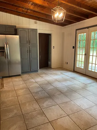 a view of a livingroom with a kitchen