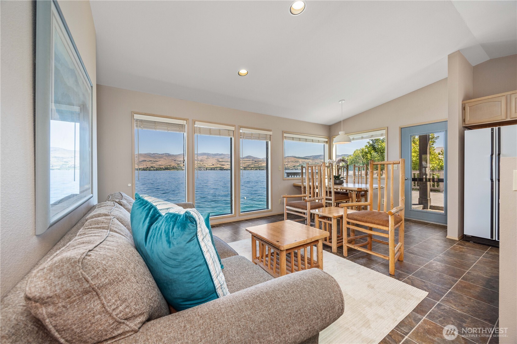 3150 South Lakeshore Road Chelan, WA 98816 - Photo 11 of 36 a living room with furniture and a large window