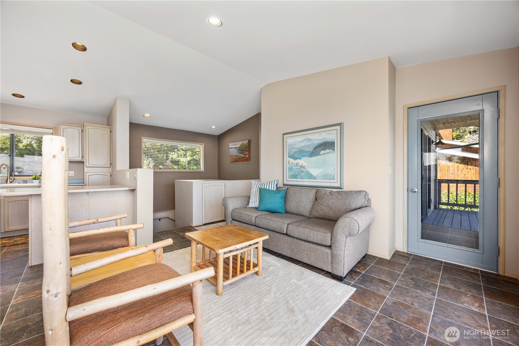 3150 South Lakeshore Road Chelan, WA 98816 - Photo 12 of 36 a living room with furniture and a area with rug