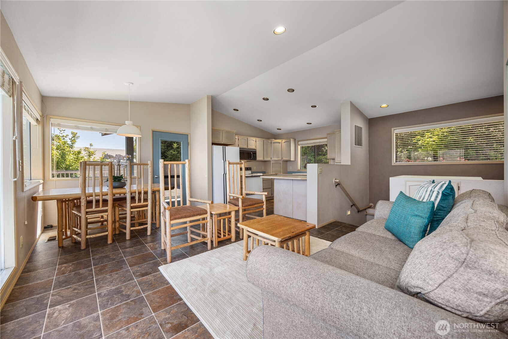 3150 South Lakeshore Road Chelan, WA 98816 - Photo 13 of 36 a living room with furniture a large window and stainless steel appliances