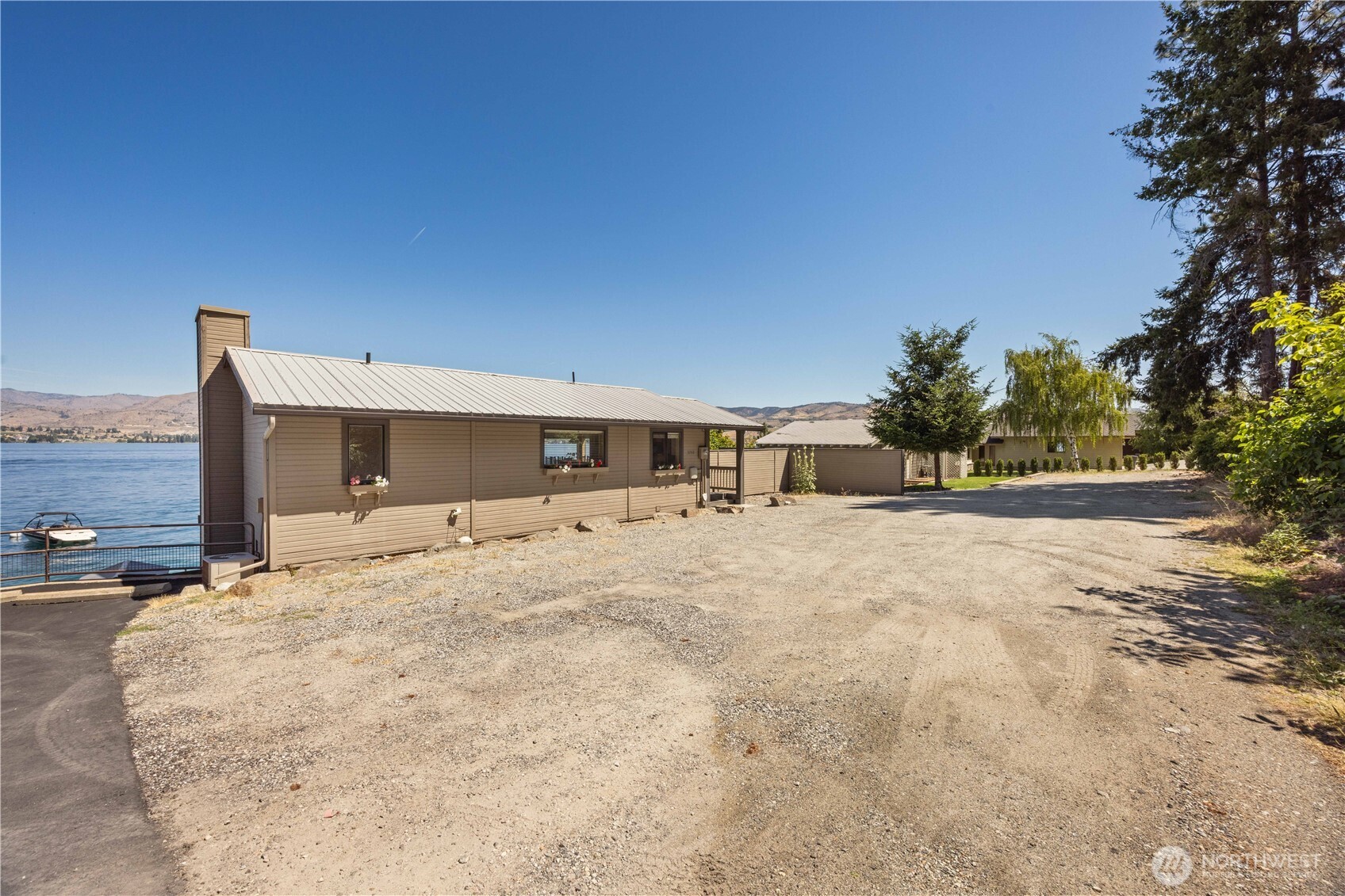 3150 South Lakeshore Road Chelan, WA 98816 - Photo 27 of 36 a view of a house with a yard