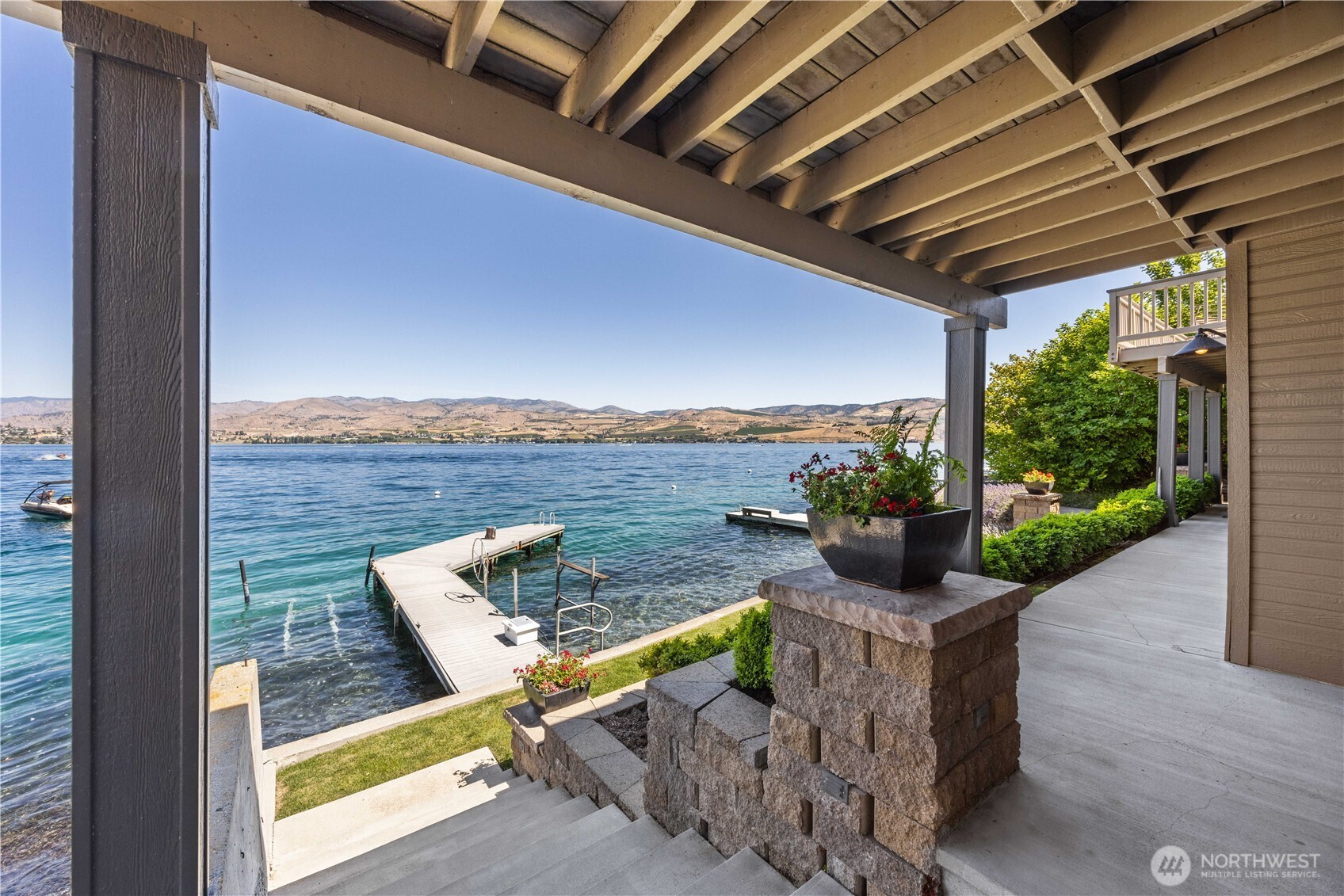 3150 South Lakeshore Road Chelan, WA 98816 - Photo 32 of 36 a view of a balcony with wooden floor and outdoor seating