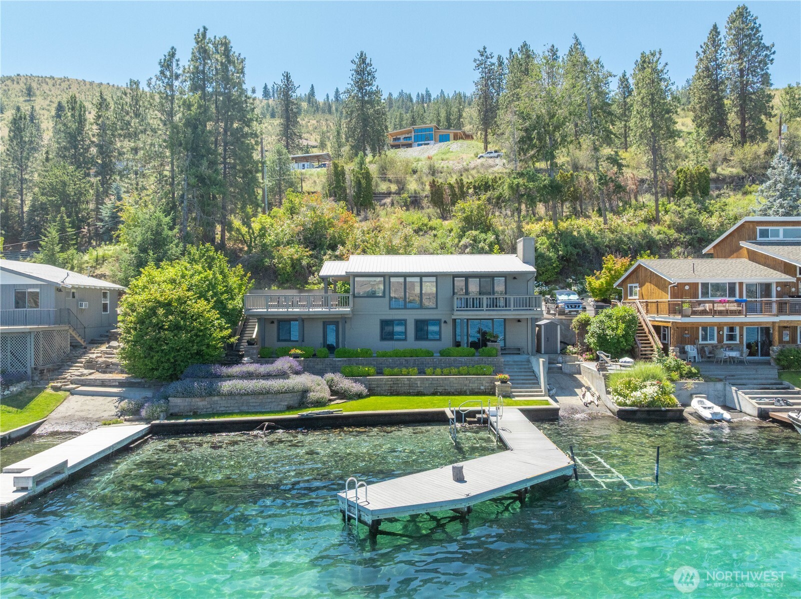 3150 South Lakeshore Road Chelan, WA 98816 - Photo 35 of 36 a view of a house with swimming pool and sitting area