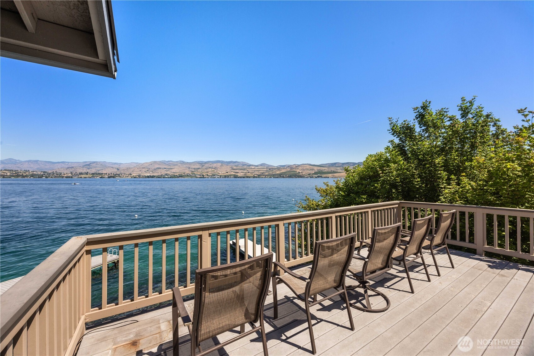 3150 South Lakeshore Road Chelan, WA 98816 - Photo 7 of 36 a view of a balcony with wooden floor and iron fence