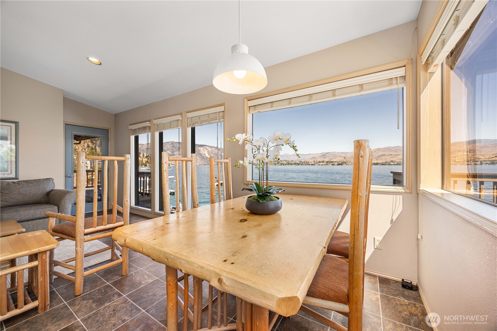 3150 South Lakeshore Road Chelan, WA 98816 - Photo 8 of 36 a view of a dining room with furniture and wooden floor