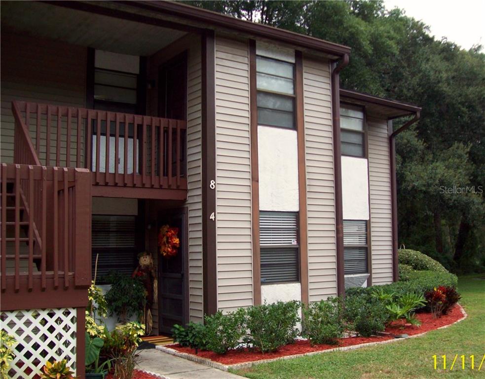 12035 Proctor Loop, Unit 4 New Port Richey, FL 34654 - Photo 1 of 1 a view of a house with wooden fence