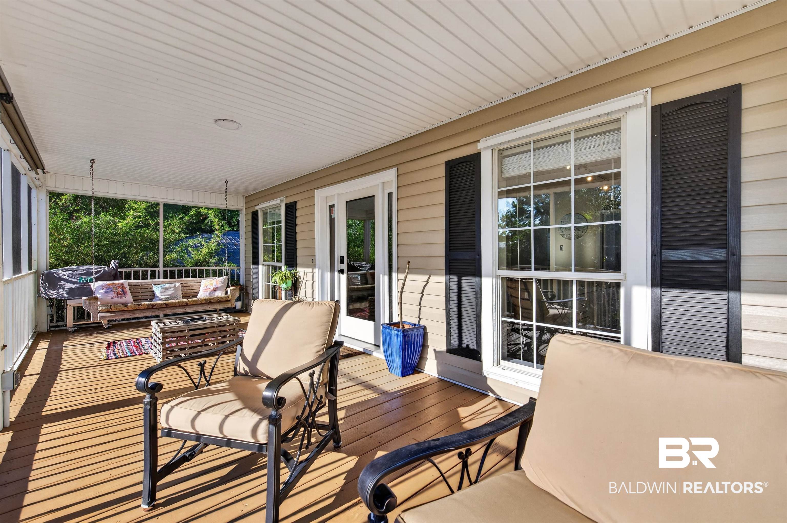 9624 North Bay Street Foley, AL 36535 - Photo 38 of 59 Expansive screened porch with wood-finish flooring