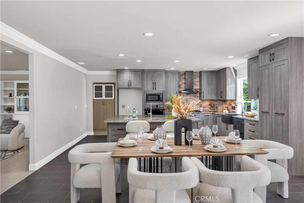 1391 Deborah Drive North Tustin, CA 92705 - Photo 11 of 56 a kitchen with kitchen island a white counter top space and appliances
