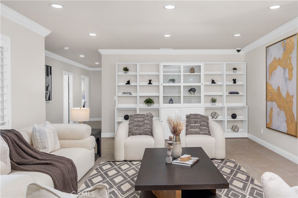 1391 Deborah Drive North Tustin, CA 92705 - Photo 17 of 56 a living room with furniture cabinets and a table