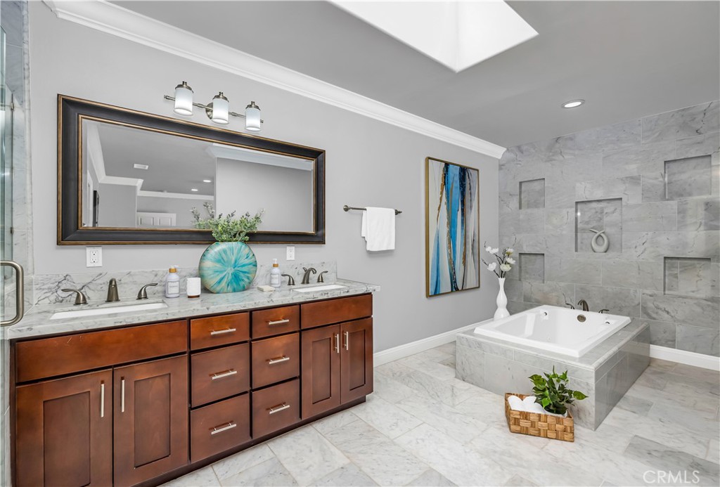 1391 Deborah Drive North Tustin, CA 92705 - Photo 25 of 56 a spacious bathroom with a tub sink and mirror