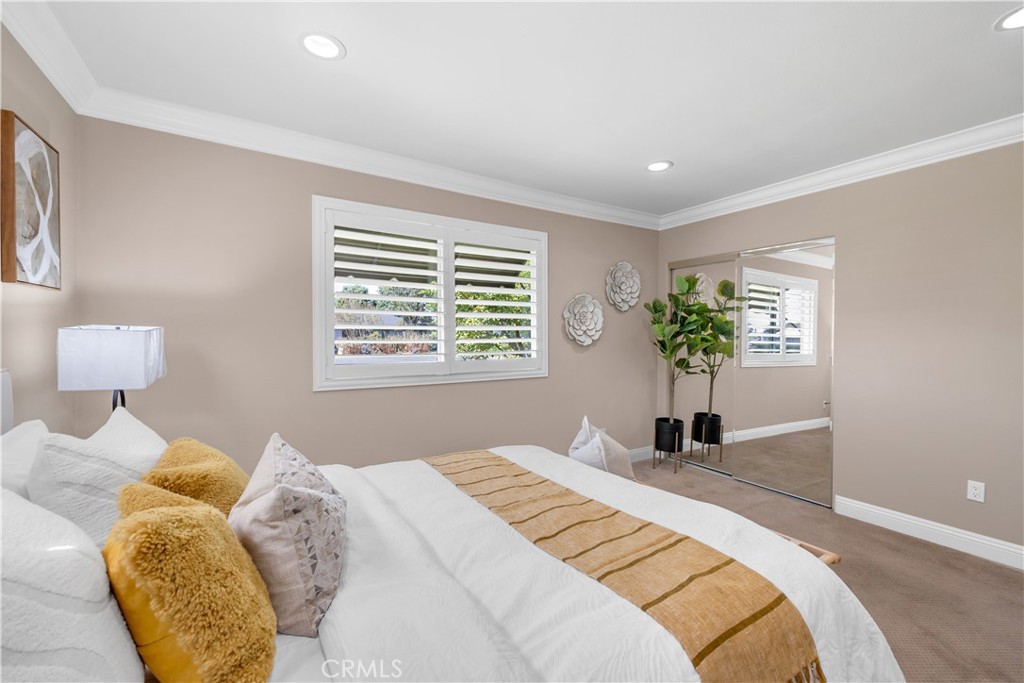 1391 Deborah Drive North Tustin, CA 92705 - Photo 26 of 56 a bedroom with a bed and a window