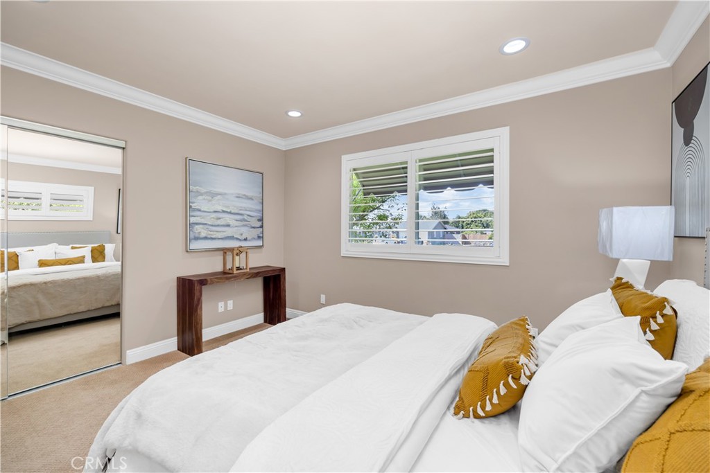 1391 Deborah Drive North Tustin, CA 92705 - Photo 28 of 56 a bedroom with a large bed and a couch