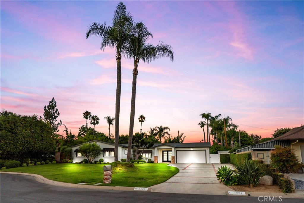 1391 Deborah Drive North Tustin, CA 92705 - Photo 53 of 56 a front view of a house with a garden and yard