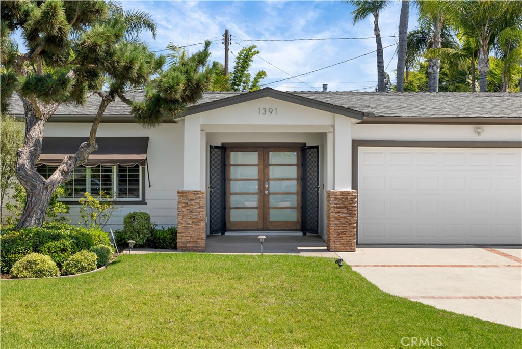 1391 Deborah Drive North Tustin, CA 92705 - Photo 7 of 56 a front view of a house with a garden