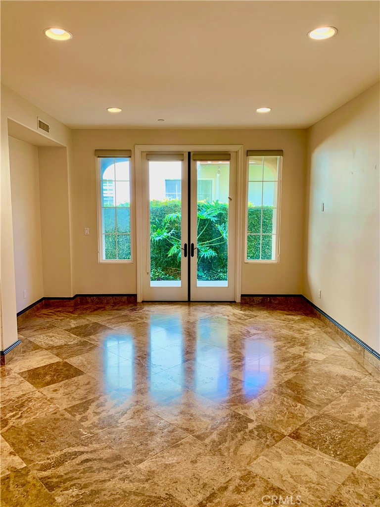 24 Calle Pacifica San Clemente, CA 92673 - Photo 11 of 41 a view of an empty room with wooden floor and a window