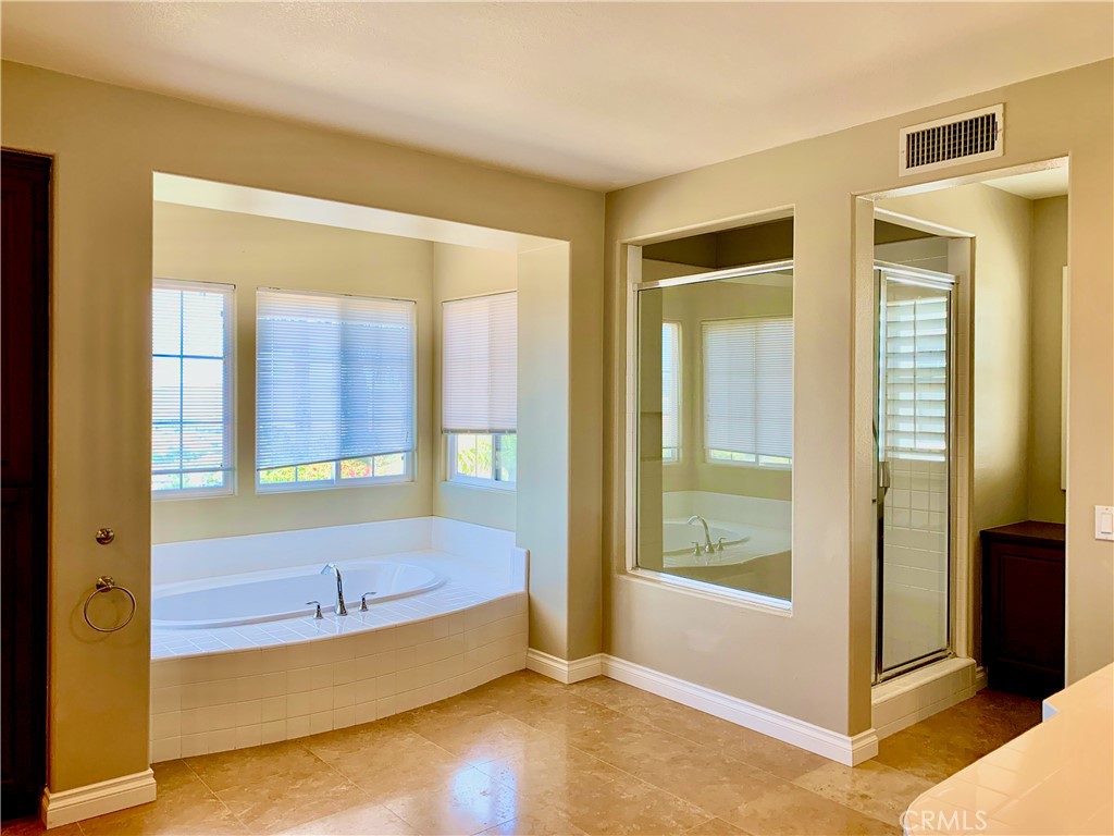 24 Calle Pacifica San Clemente, CA 92673 - Photo 22 of 41 a bathroom with a tub and shower