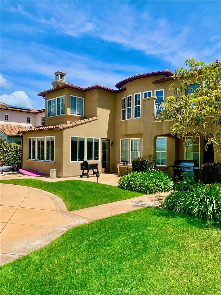 24 Calle Pacifica San Clemente, CA 92673 - Photo 27 of 41 a front view of a house with a yard