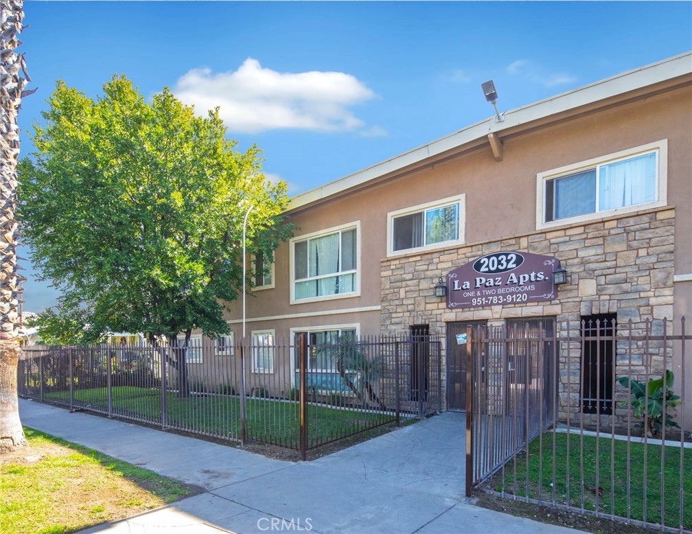 2032 West Linden Street Riverside, CA 92507 - Photo 5 of 66 a view of a house with a yard and potted plants