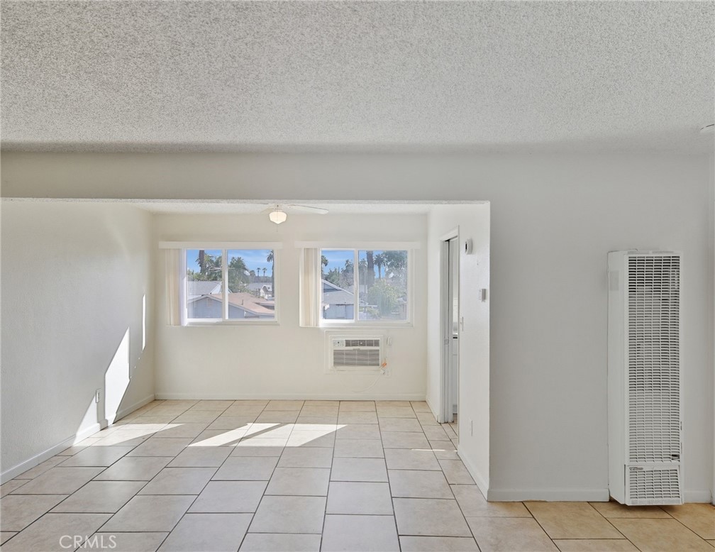 2032 West Linden Street Riverside, CA 92507 - Photo 52 of 66 a view of a livingroom with wooden cabinets and a window