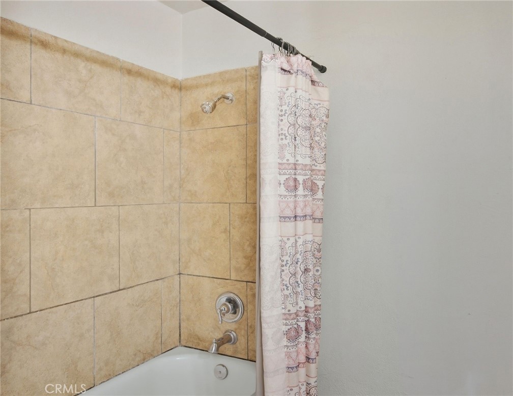 2032 West Linden Street Riverside, CA 92507 - Photo 62 of 66 a bathroom with a shower toilet and a shower