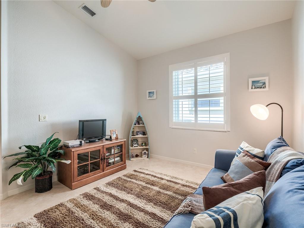 9460 Sun River Way Estero, FL 33928 - Photo 19 of 41 a living room with furniture and a potted plant