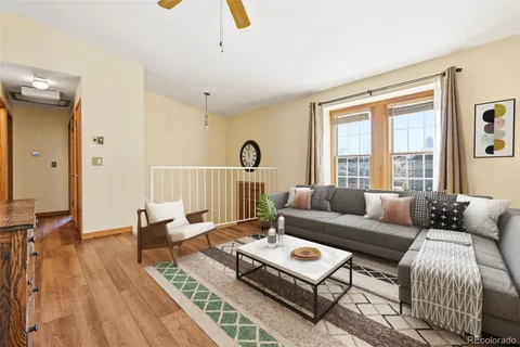 a living room with furniture and a table