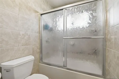 a view of a livingroom with furniture and a flat screen tv